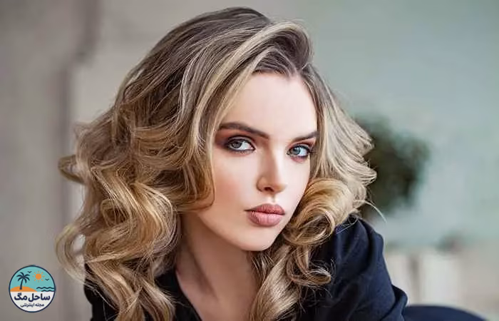 Woman with curly long layers and highlights