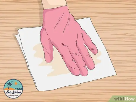 Step 1 Soak up the oil with a paper towel.
