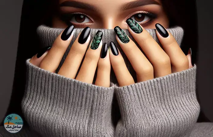 Black nail polish with dark green leaf design